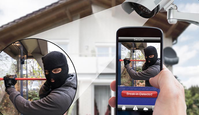 a person detecting burglary on their phone using a camera