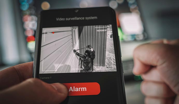 a person detecting burglary live using their phone