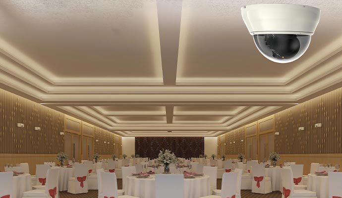 A dome security camera installed in the event room