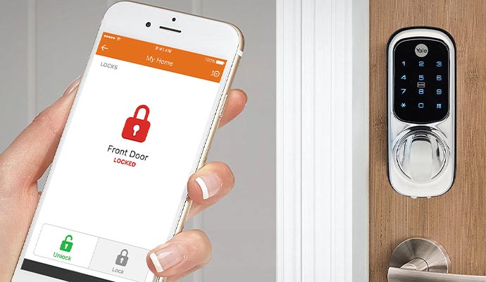 Person holding smartphone with Front Door Locked app