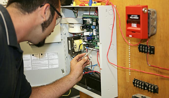 Person installing fire alarm system