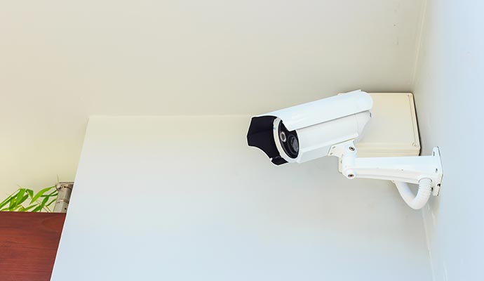 An installed security camera on wall